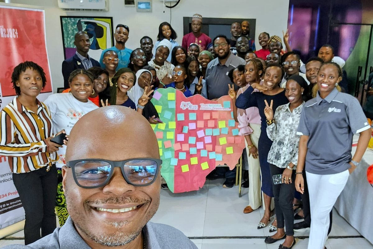 Mobolaji with a 234 Project workshop group and their map of Nigeria built from notes
